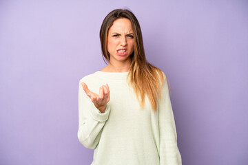 pretty young adult woman looking angry, annoyed and frustrated screaming wtf or what’s wrong with...