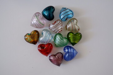 heart marbles, mixed marbles in various colors and patterns. view from above isolated photo. Decorative concept idea