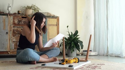 Stressed 20s young woman and do it yourself furniture assembly problem. home improvement concept. 4k footage