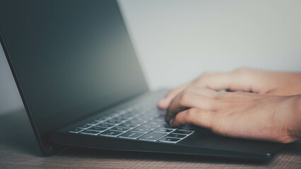 Hand using laptop computer for communication social or searching web, working job at home, education online, blogger, shopping having workplace at home, home quarantine.