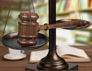 Legal office of lawyers, justice and law concept, scale of justice on a desk in a courtroom,