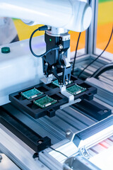 automatic robot for print circuit board (PCB)assembly machine during soldering or welding part at factory