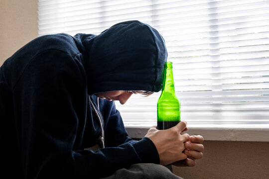 Sad Young Man with a Beer