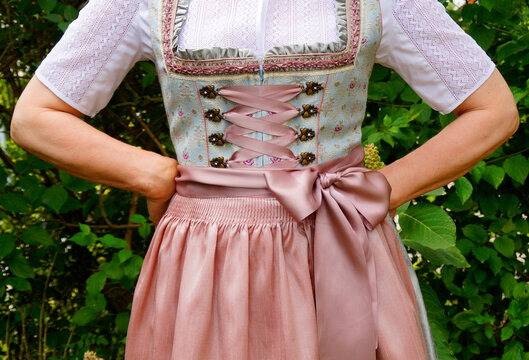 a woman in a beautiful traditional Bavarian dirndl dress at the Bavarian October fest (Oktoberfest) (Munich, Bavaria, Germany)	