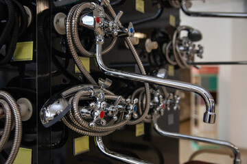 Plumbing shower faucets at the exhibition in the store