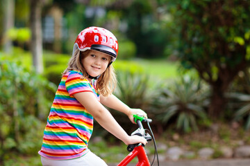 Fototapeta na wymiar Kids on bike. Child on bicycle. Kid cycling.