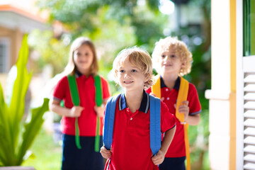 Child going back to school. Start of new school year after summer vacation. Little girl with backpack and books on first school day. Beginning of class. Education for kindergarten and preschool kids.