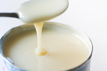 condensed milk in a bowl close up,