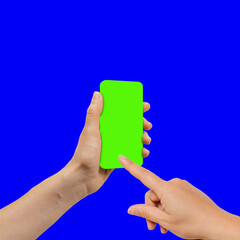 Woman's hand showing smartphone with green screen in vertical position, the device is positioned slightly turned