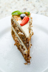 Carrot cake on a white plate macro close up selective focus
