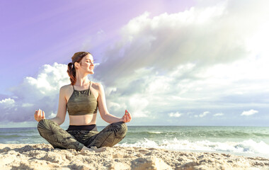 Fototapeta na wymiar Woman in lotus position on beach. Girl enjoys meditation outdoors. Yoga harmony of soul and body healing