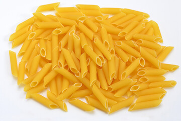 heap of pasta penne rigate durum wheat close up on white background