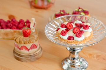 Confectionery with cream and berries. Baking baskets with fresh berries.