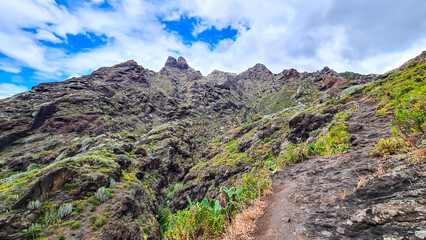 Panoramic view on El Dedo del Roque Pai crag, Roque Paez in the Anaga mountain range, Tenerife, Canary Islands, Spain, Europe. Scenic hiking trail from Afur to Taganana through canyon Barranco de Afur