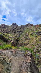 Panoramic view on El Dedo del Roque Pai crag, Roque Paez in the Anaga mountain range, Tenerife, Canary Islands, Spain, Europe. Scenic hiking trail from Afur to Taganana through canyon Barranco de Afur