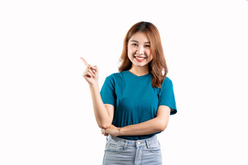 A graceful Asian woman smiles happily and points to a separate empty space on a white background.