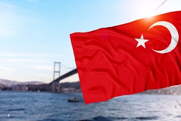 The Turkish flag waving over the bridge, July 15 bridge in the background