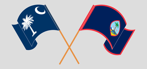 Crossed and waving flags of The State of South Carolina and Guam