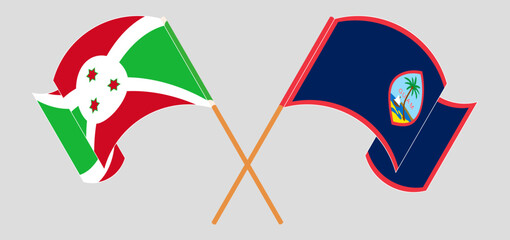 Crossed and waving flags of Burundi and Guam