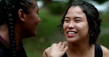African woman putting coins inside piggy bank. Person saving money