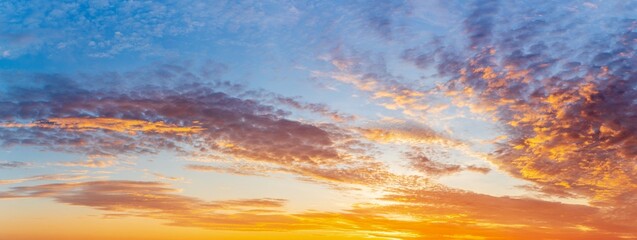 Fototapeta na wymiar Panoramic sunset sky and clouds background