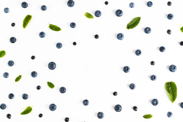 Blueberries and blueberries and mint leaves on a white background.