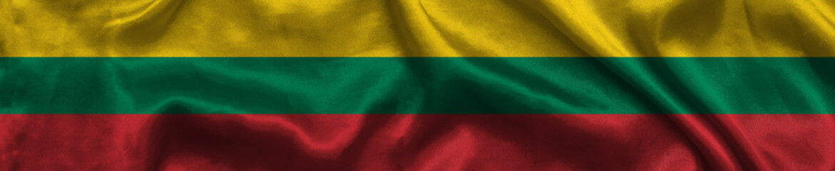 Elongated national flag of Lithuania with a fabric texture fluttering in the wind. Lithuanian flag for website design. 3d illustration