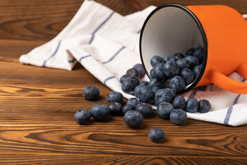 Blueberries on a brown texture background. Ripe and fresh blueberries. Vitamins. Healthy food. Juicy berry. Copy space. Place for text
