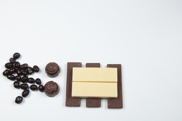 Chocolate bars and chocolates on a white background