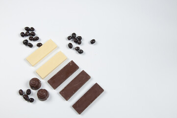 Chocolate bars and chocolates on a white background