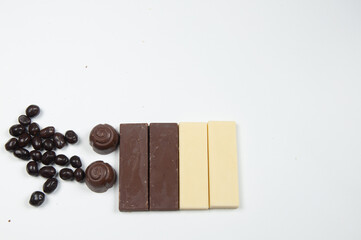 Chocolate bars and chocolates on a white background