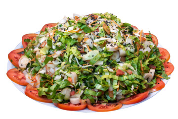Salad mix with lettuce, hearts of palm, tomatoes, cucumbers, carrots and sesame seeds on white isolated background
