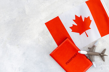 Flag of Canada with passport. Travel visa and citizenship concept
