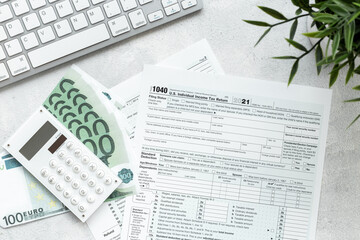 US tax form on office table desktop. Accountant culculate taxes