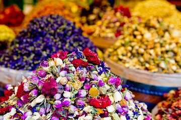 Herbal tee sold at Egypt Bazaar (Misir Carsisi) in Istanbul, Turkey (Turkiye). Multicolor blossoms. Selected focus, copy space, colorful background