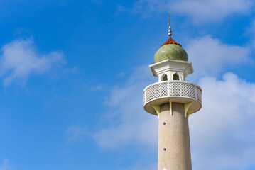 mosque dome on blue sky background and soft white cloud with free space for text information.symbol of islamic religion,concept for Ramadan, Eid al Fitr, eid ad-ha, meditation, islamic praying