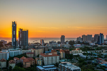The Cityscape and the buildings of Pattaya District Chonburi Thailand Southeast Asia during the sunset time - obrazy, fototapety, plakaty