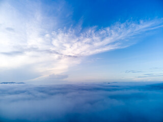 Fototapeta na wymiar blue sky background with sea of fog,sky over hill in summer season morning sunrise