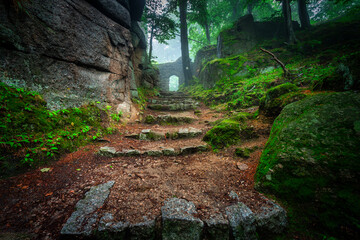 A foggy landscape of stairs from hellish Valley to Chojnik Castle in the Karkonosze Mountains....