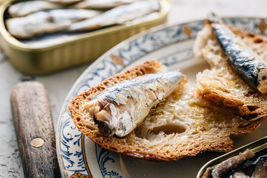 Closeup of a plate of bread with sardines