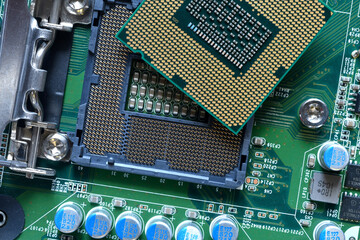 Detail of a CPU Processor over his Socket on a Motherboard. Printed Circuit Board - Computer...