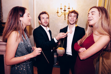 People eating melon during party