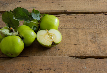 green apples on a wooden table
