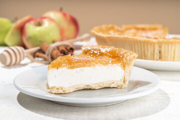 Homemade caramel apple pie cheesecake, sweet cheese  apple cake with caramelized apple sauce