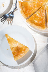 Homemade caramel apple pie cheesecake, sweet cheese  apple cake with caramelized apple sauce