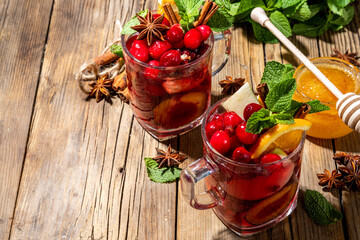 Christmas mulled wine with aromatic spices and citrus fruits and berry. Hot autumn winter fruity...