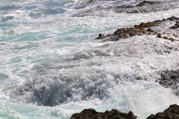 waves crashing on rocks