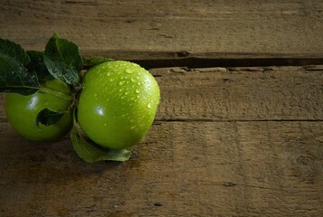 green english apple on a wooden table