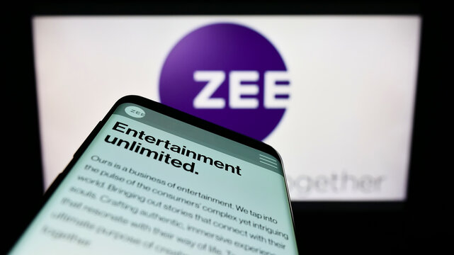Stuttgart, Germany - 07-24-2022: Mobile phone with website of company Zee Entertainment Enterprises Limited on screen in front of logo. Focus on top-left of phone display.