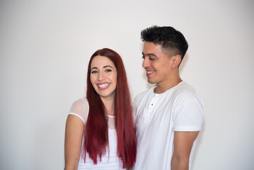 couple in love, young latin man, redhead woman, funny, smiles
